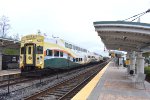 A southbound early morning Sunrail train sits at Sand Lake Road Station in Orlando with Bombardier Bilevel Cab Car # 2002 on the point. 